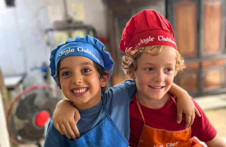 Two children happy while cooking