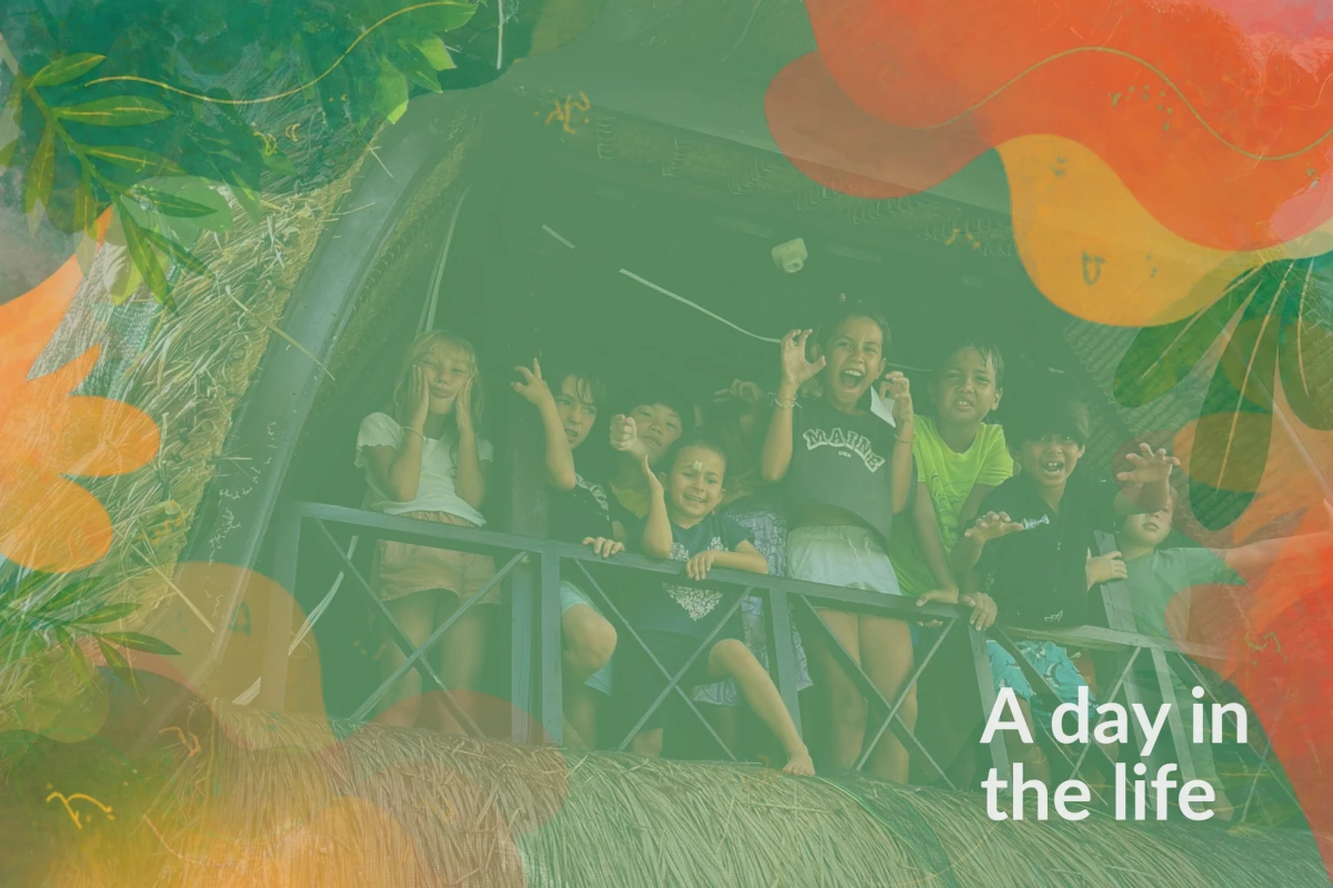 A day in the life video cover with children posing in a bamboo house